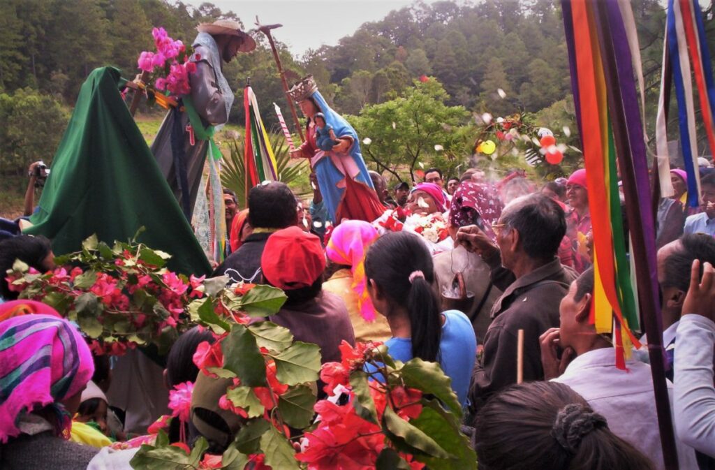 Vibrant Honduran carnival celebration with colorful masks, traditional costumes, street performers and joyful crowds dancing